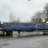 The Southdown team use an extendable trailer - or trombone trailer - to deliver a load of 20+ metre beams for a construction project Using a lorry cab and stretch trailer, the Southdown team deliver a load of 20+ metre beams for a construction project