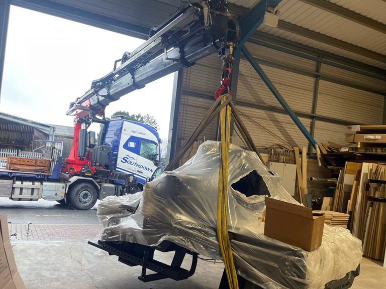Southdown truck and crane lifting woodworking machinery