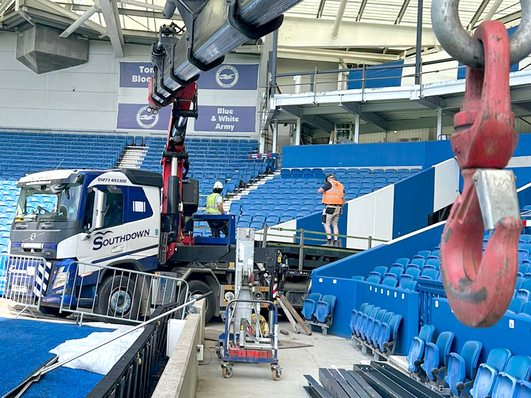 The Southdown team use a 71 t/m crane and outrigger to lift some steel into the stands at the AMEX Stadium